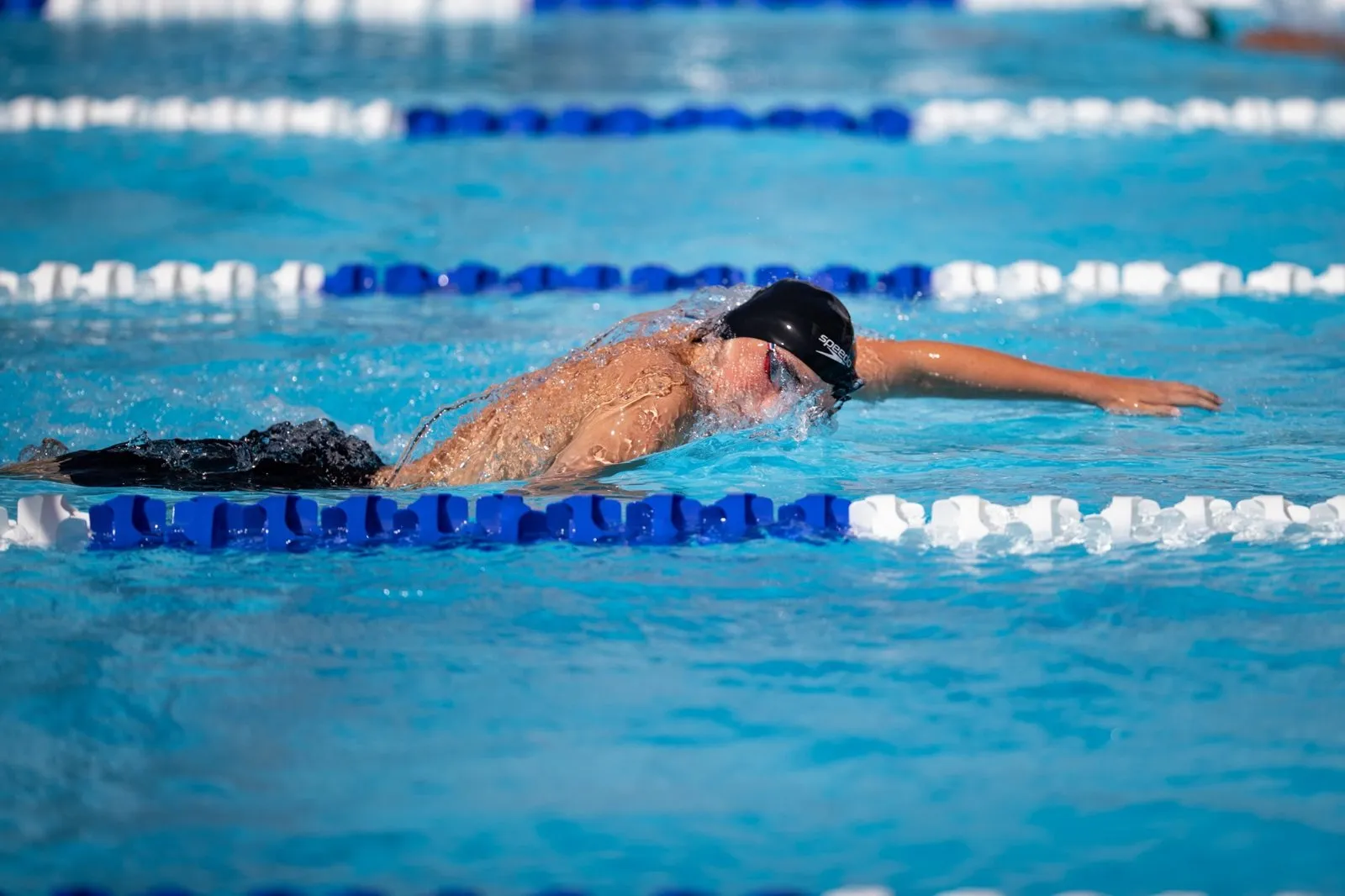 Aiden Sabocik swimming freestyle in a race