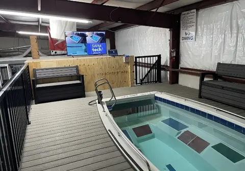 The Endless Pool deck at SwimTec Gainesville, with the review screen on the wall